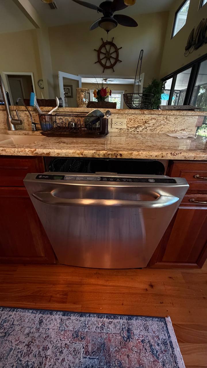 GE Profile dishwasher installed under the kitchen counter in a Naples home