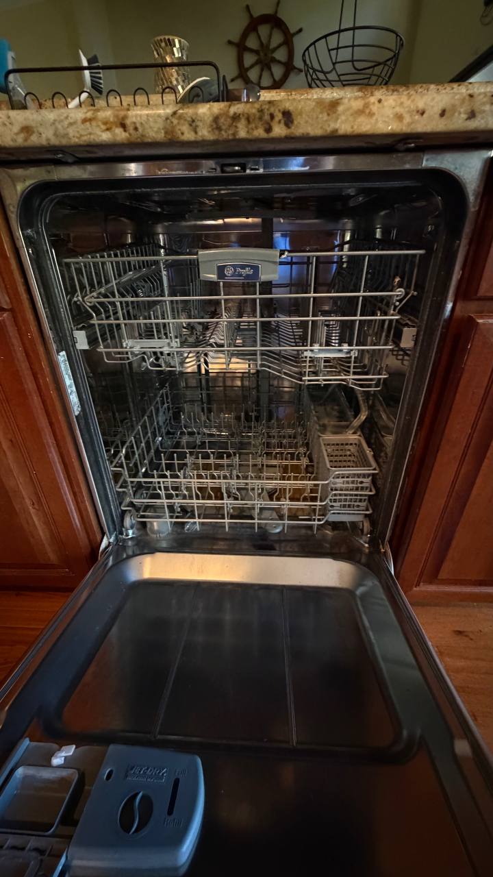 GE Profile dishwasher racks open showing the interior after service